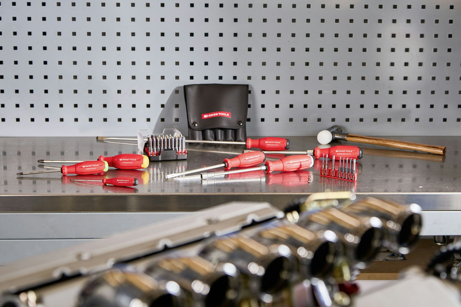 Precision industrial tools and calibration instruments laid out on a workbench