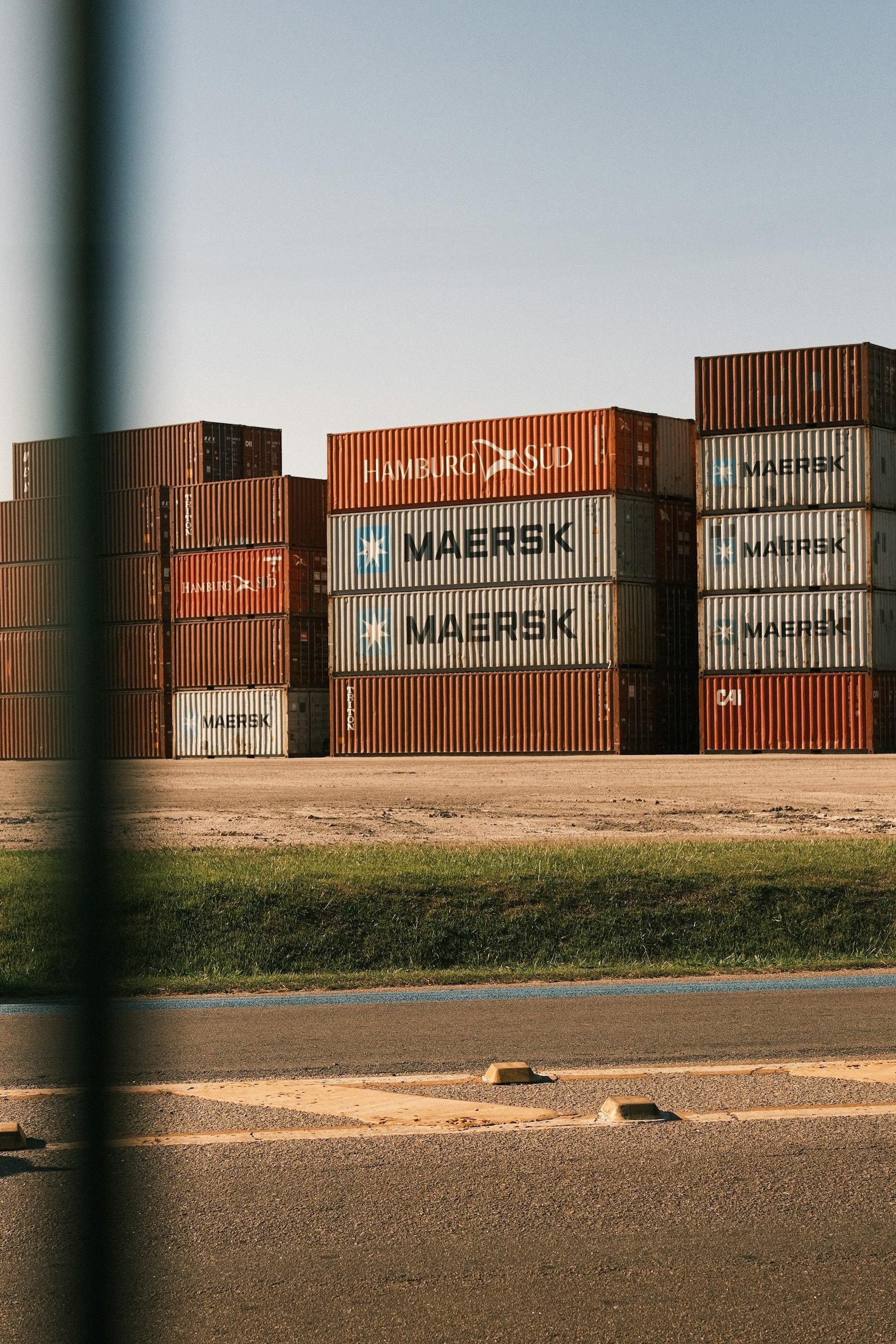 Logistics control room with operators monitoring live shipment routes on a world map